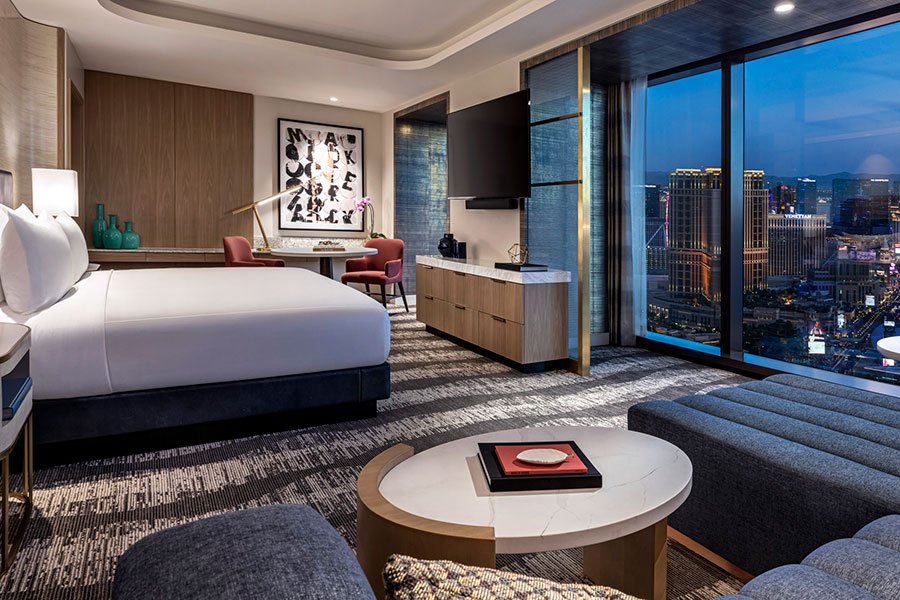 Room with King Bed and Table with Strip View